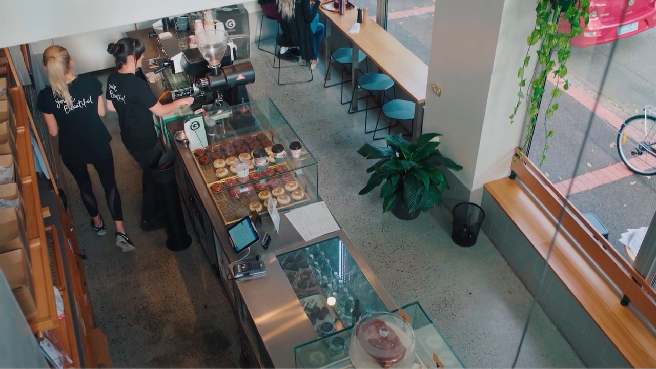 Cafe scene with hospitality workers