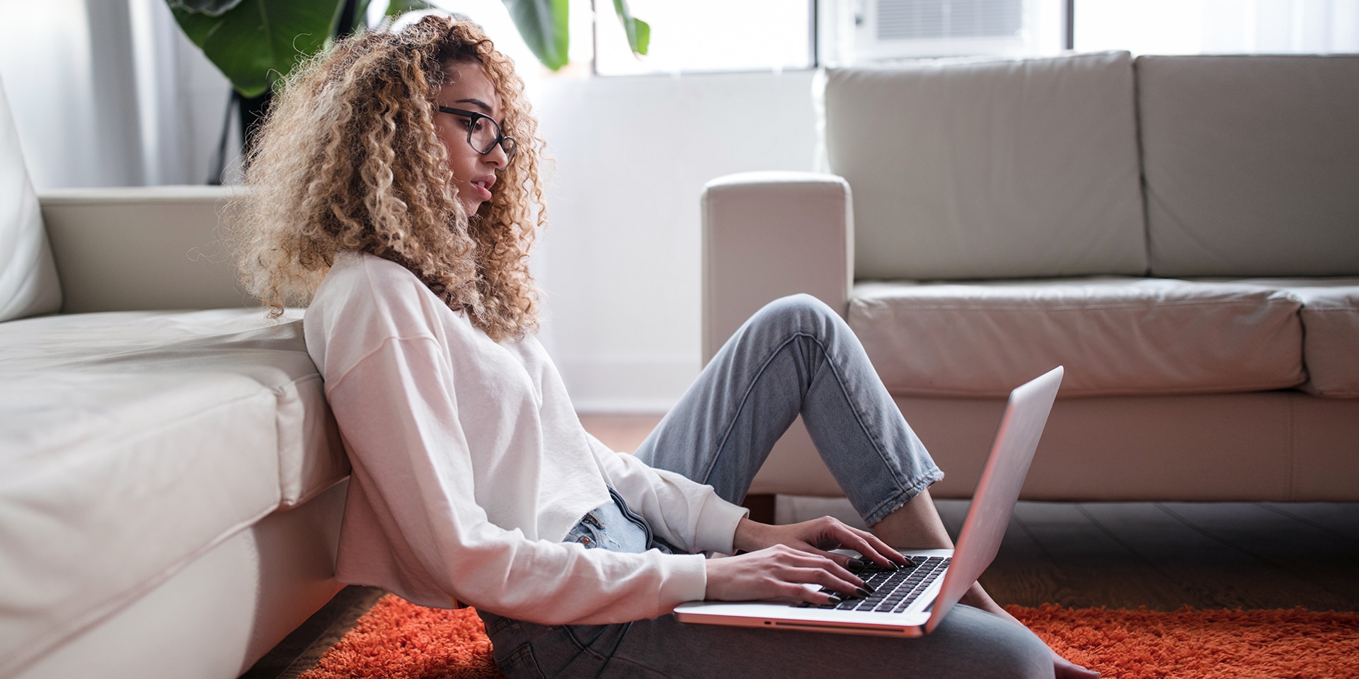 woman working form home on the living room floor